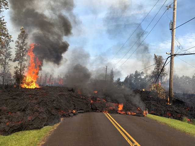 Lava advances along a street near a fissure in Leilani Estates, on Kilauea volcano's lower east rift zone, Hawaii