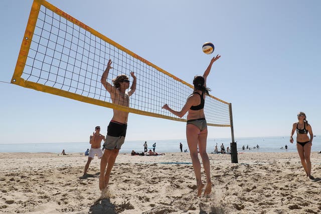 A game of beach volleyball during the heatwave in Boscombe, Dorset
