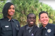 Police officers escort students with special needs to prom
