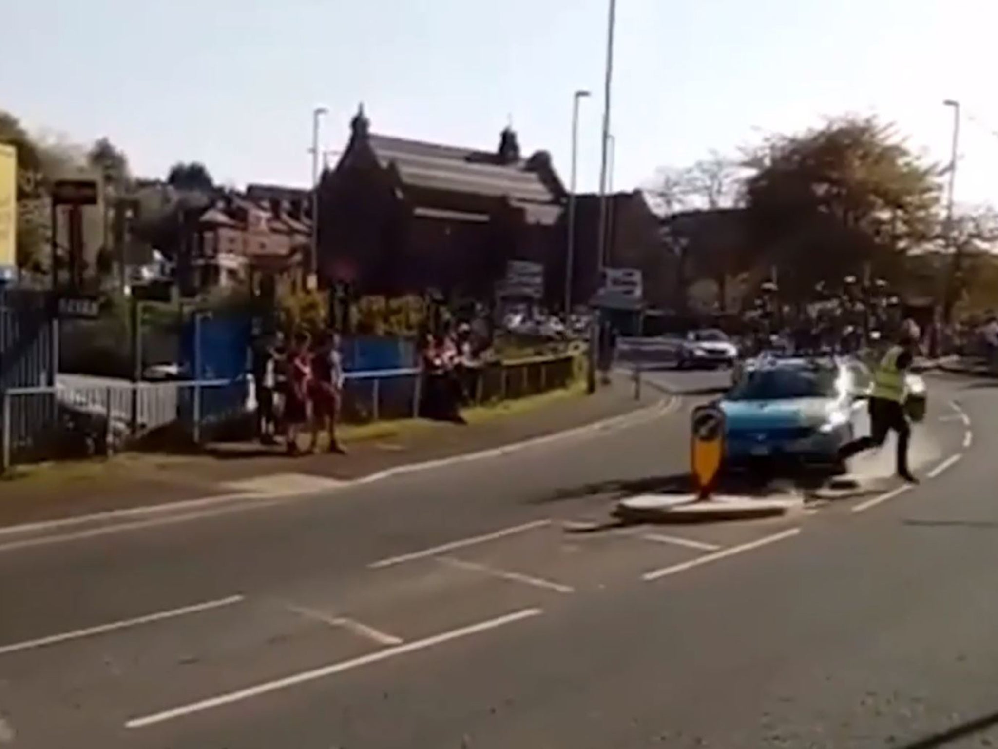 The car plowed through the traffic island