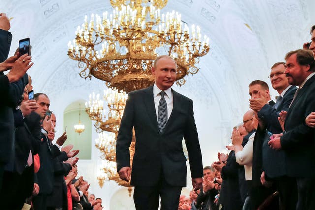 Russian President Vladimir Putin walks before an inauguration ceremony at the Kremlin in Moscow