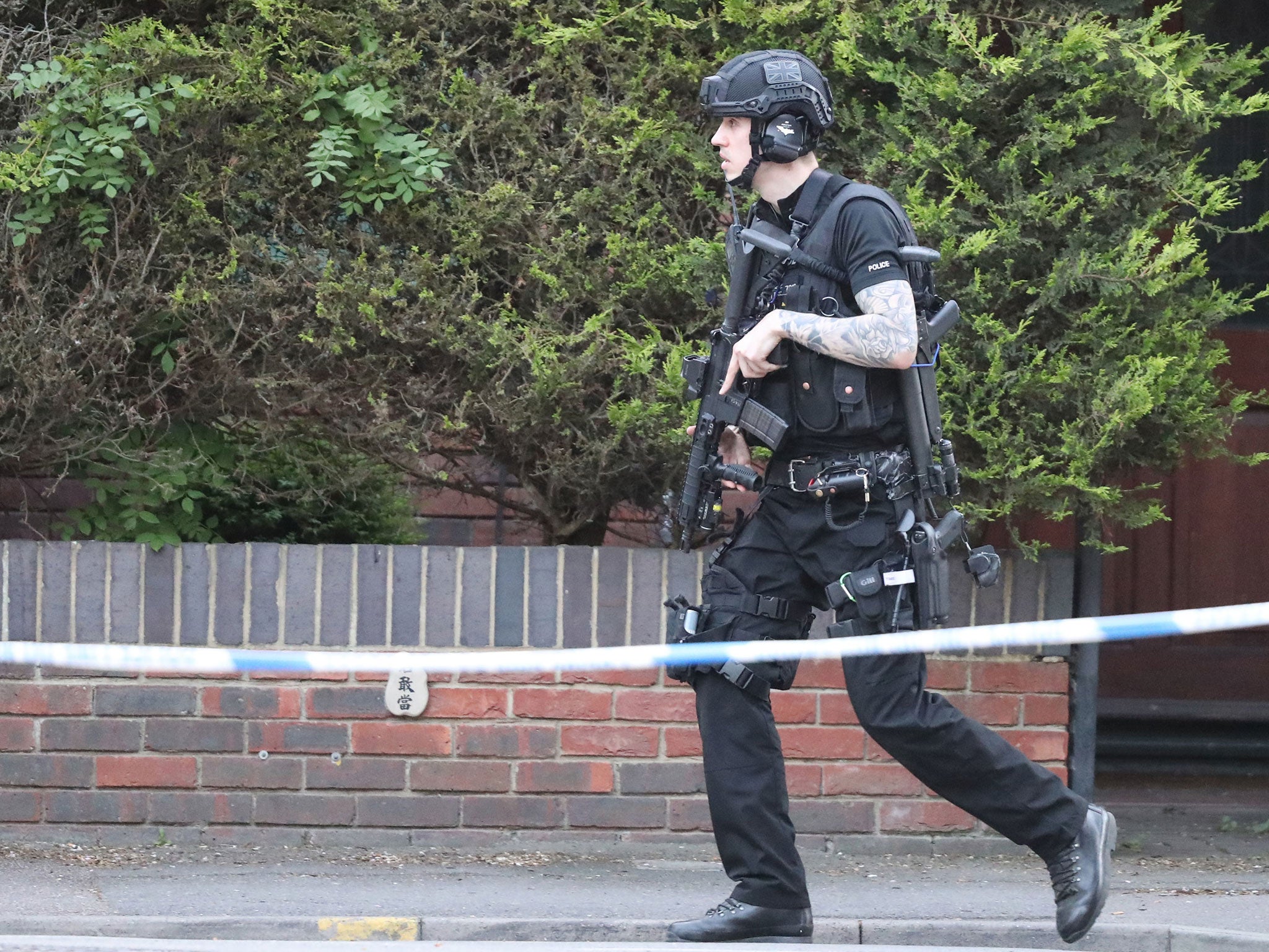 An armed police officer at the scene of the stand-off