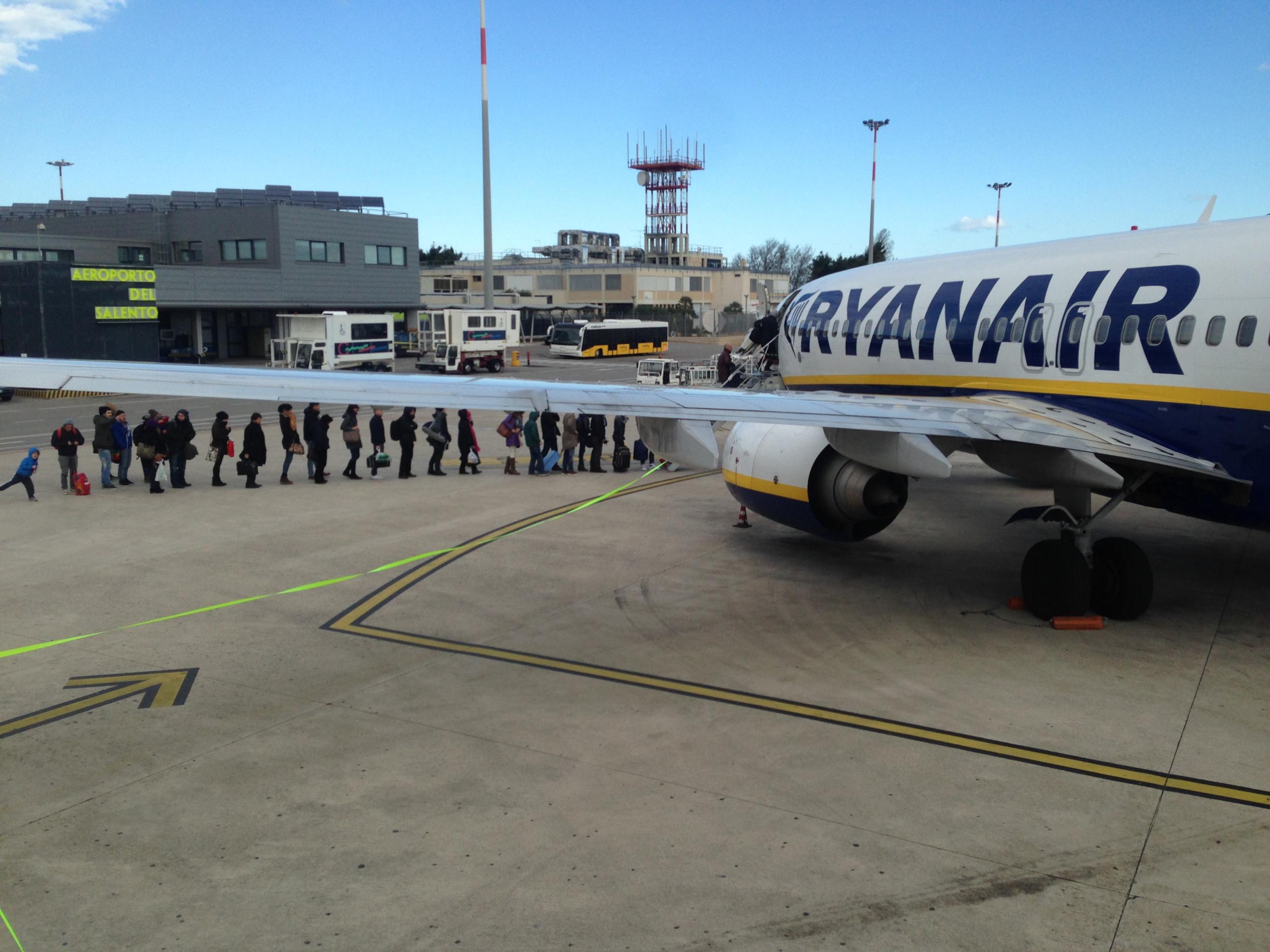Going places? Passengers boarding a Ryanair flight at Brindisi Airport. The Irish airline is by far the biggest carrier in Italy