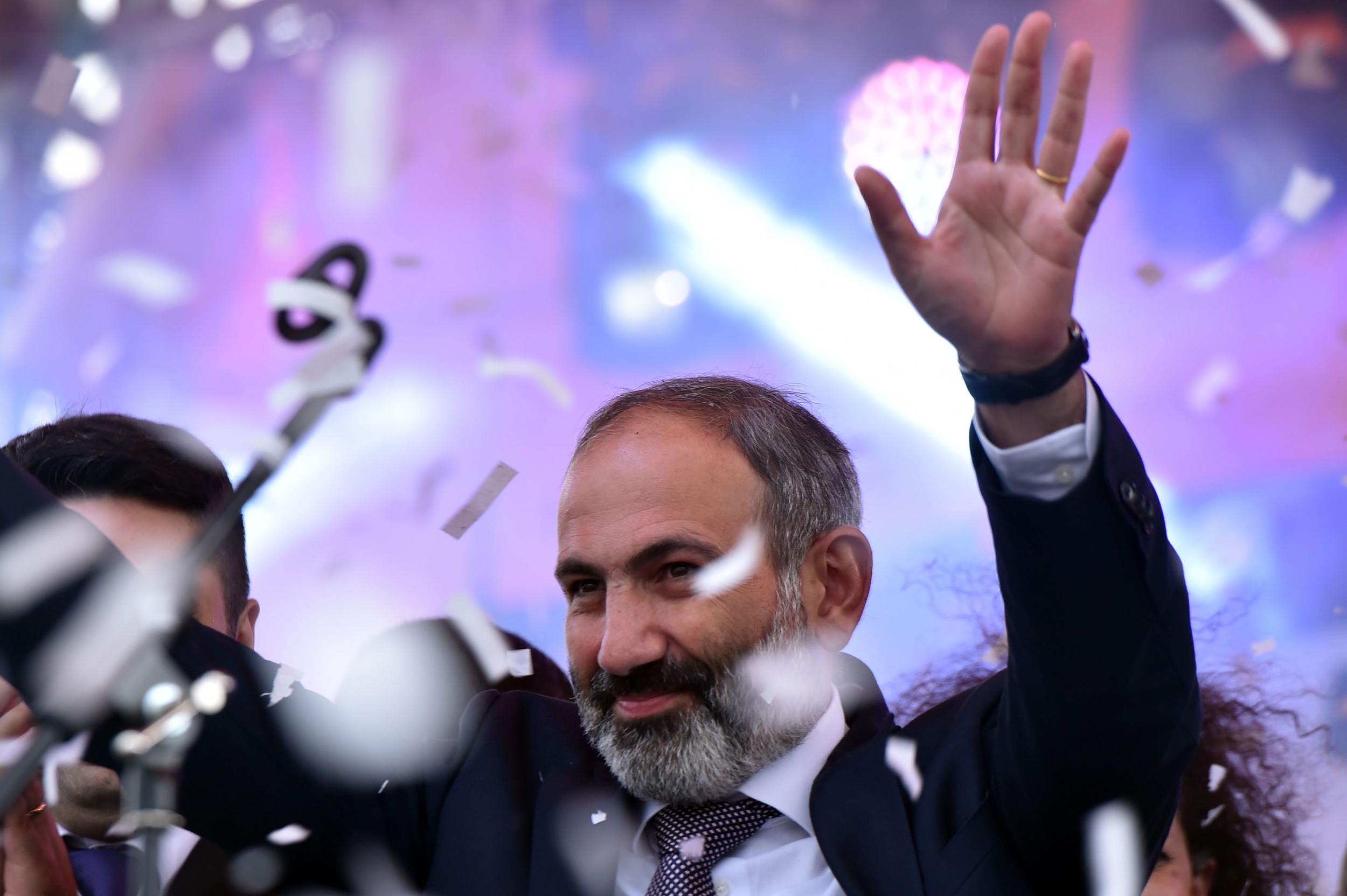 Armenian opposition leader Nikol Pashinyan waves to supporters after being elected prime minister in Yerevan’s Republic Square
