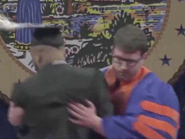 Graduation marshal forces student off stage during ceremony