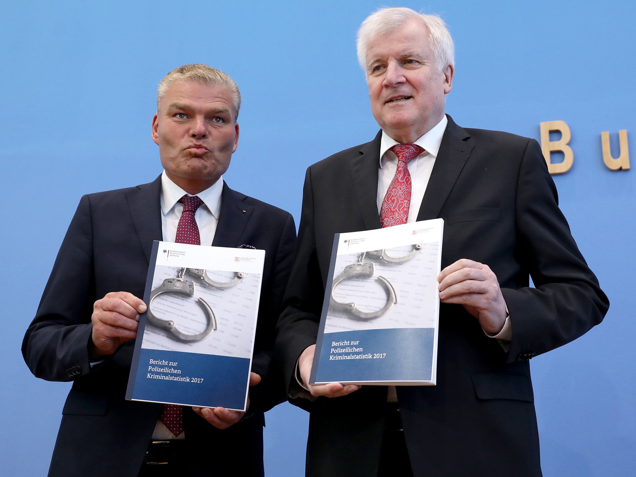 German Interior minister Horst Seehofer (r) present the German 2017 crime statistics in Berlin