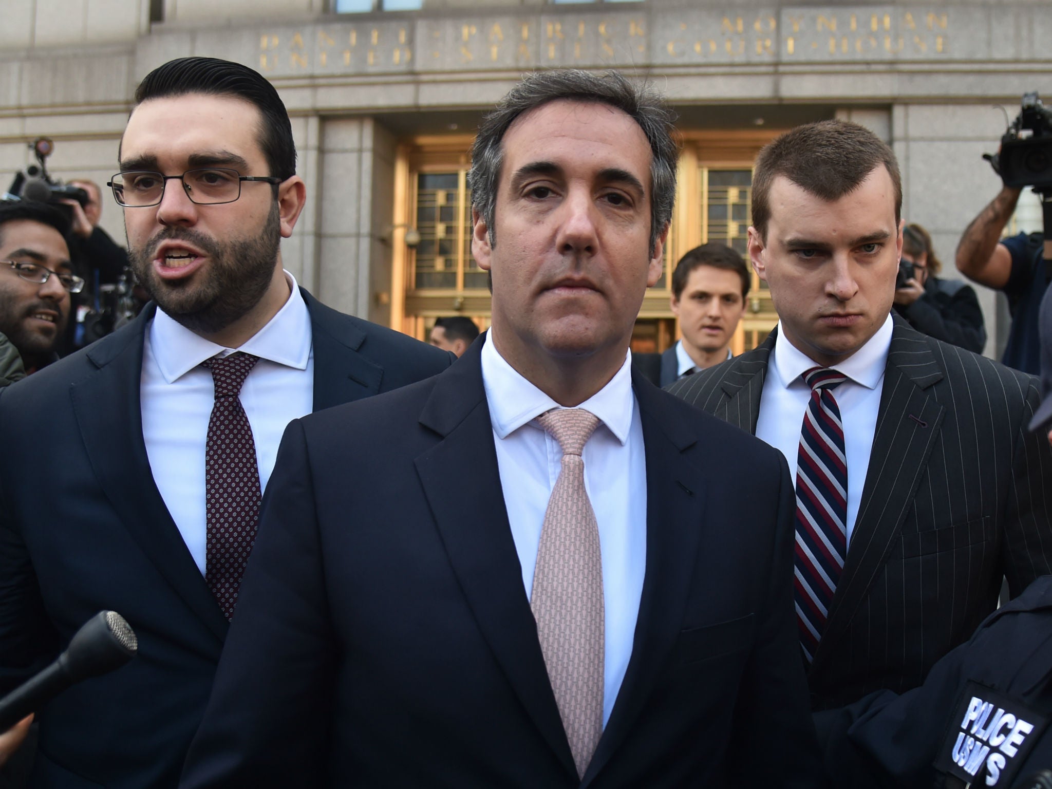 Michael Cohen leaves the US courthouse in New York
