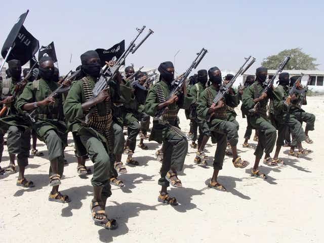 Hundreds of newly trained al-Shabab fighters perform military exercises in the Lafofe area some 18 km south of Mogadishu, in Somalia