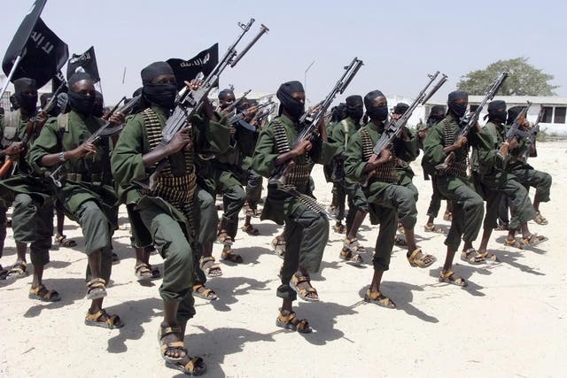 Hundreds of newly trained al-Shabab fighters perform military exercises in the Lafofe area some 18 km south of Mogadishu, in Somalia