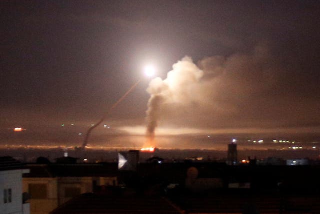 Missiles rise into the sky as Israeli missiles hit air defense position and other military bases, in Damascus, Syria. The Israeli military on Thursday said it attacked "dozens" of Iranian targets in neighboring Syria in response to an Iranian rocket barrage on Israeli positions in the Golan Heights, in the most serious military confrontation between the two bitter enemies to date.