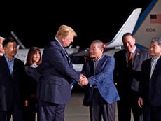 Trump greets hostages freed by North Korea as they touch down in US