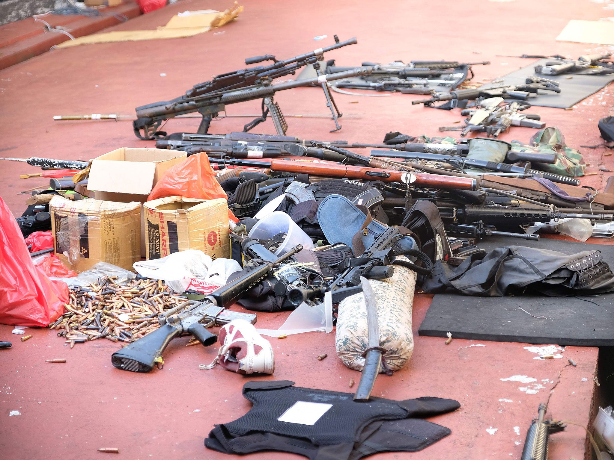 Firearms, ammunition, and bulletproof gear that prisoners used during a riot at the Mobile Police Brigade headquarters in Depok
