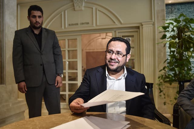 Libyan dissident Abdel Hakim Belhaj reads the letter of apology he received from the UK government, at the British Consulate in Istanbul