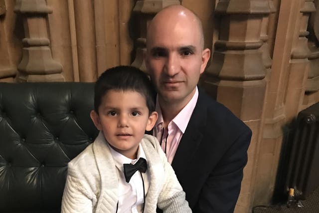 Hamid Ali Jafari with his four-year-old son Amaad following a meeting with Theresa May