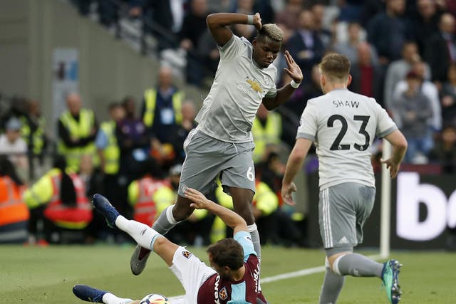 West Ham United’s Mark Noble challenges Paul Pogba