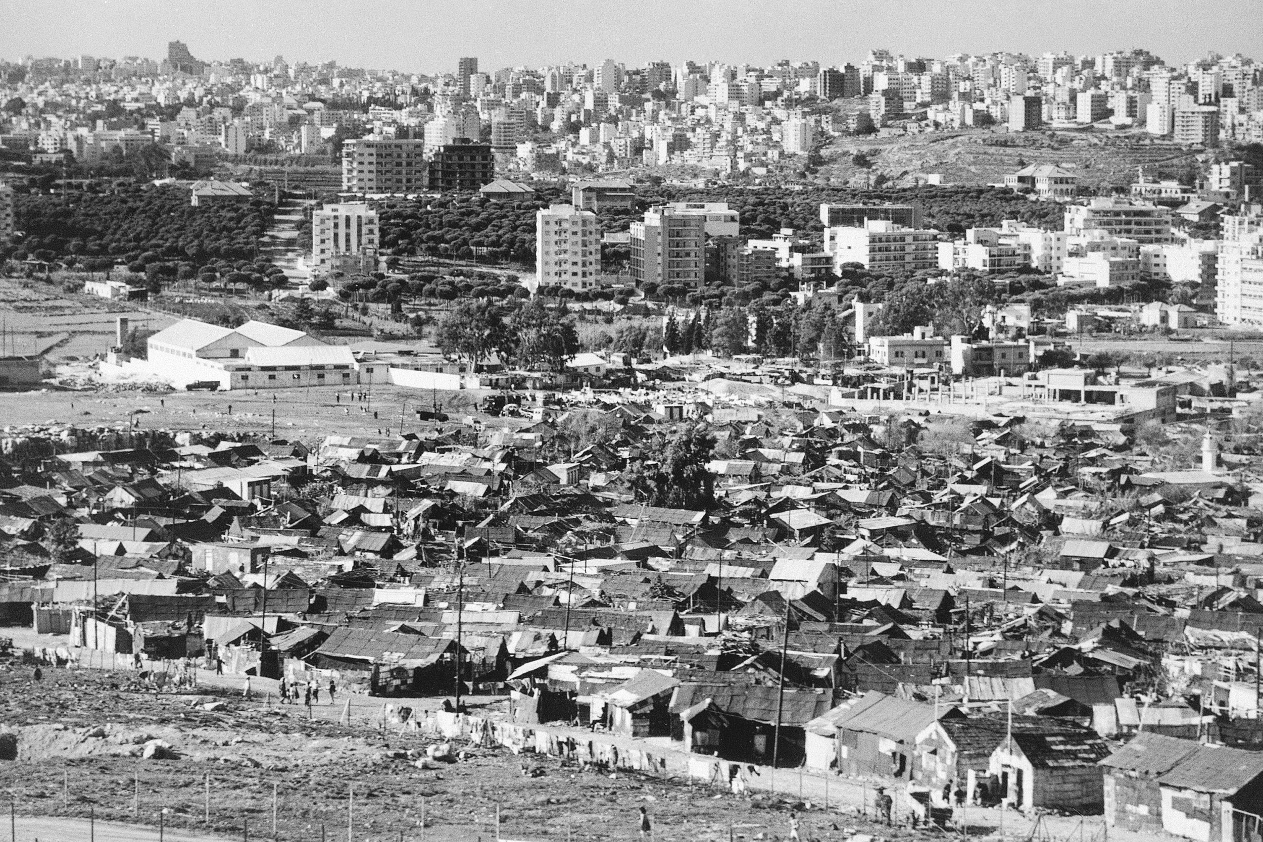 On the outskirts of Beirut, the Dekwaneh refugee camp, with its prefabricated, adobe-styled huts makes a stark contrast with the luxury apartment blocks of the Lebanese capital