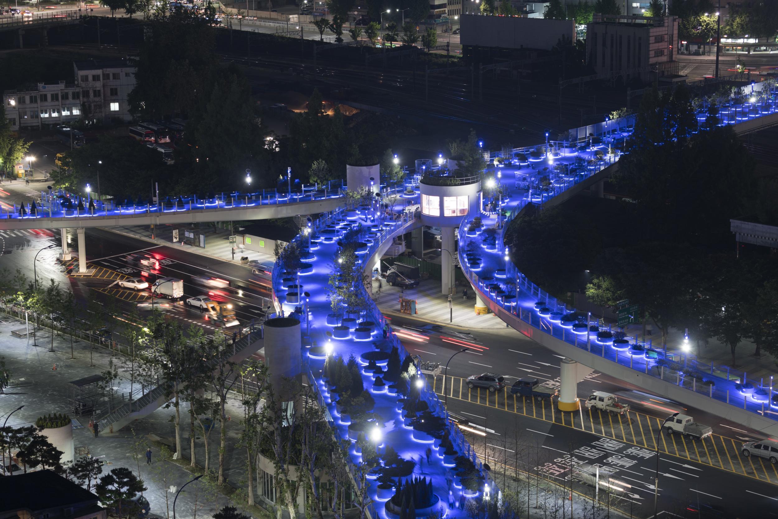 Blue lights transform the space by night