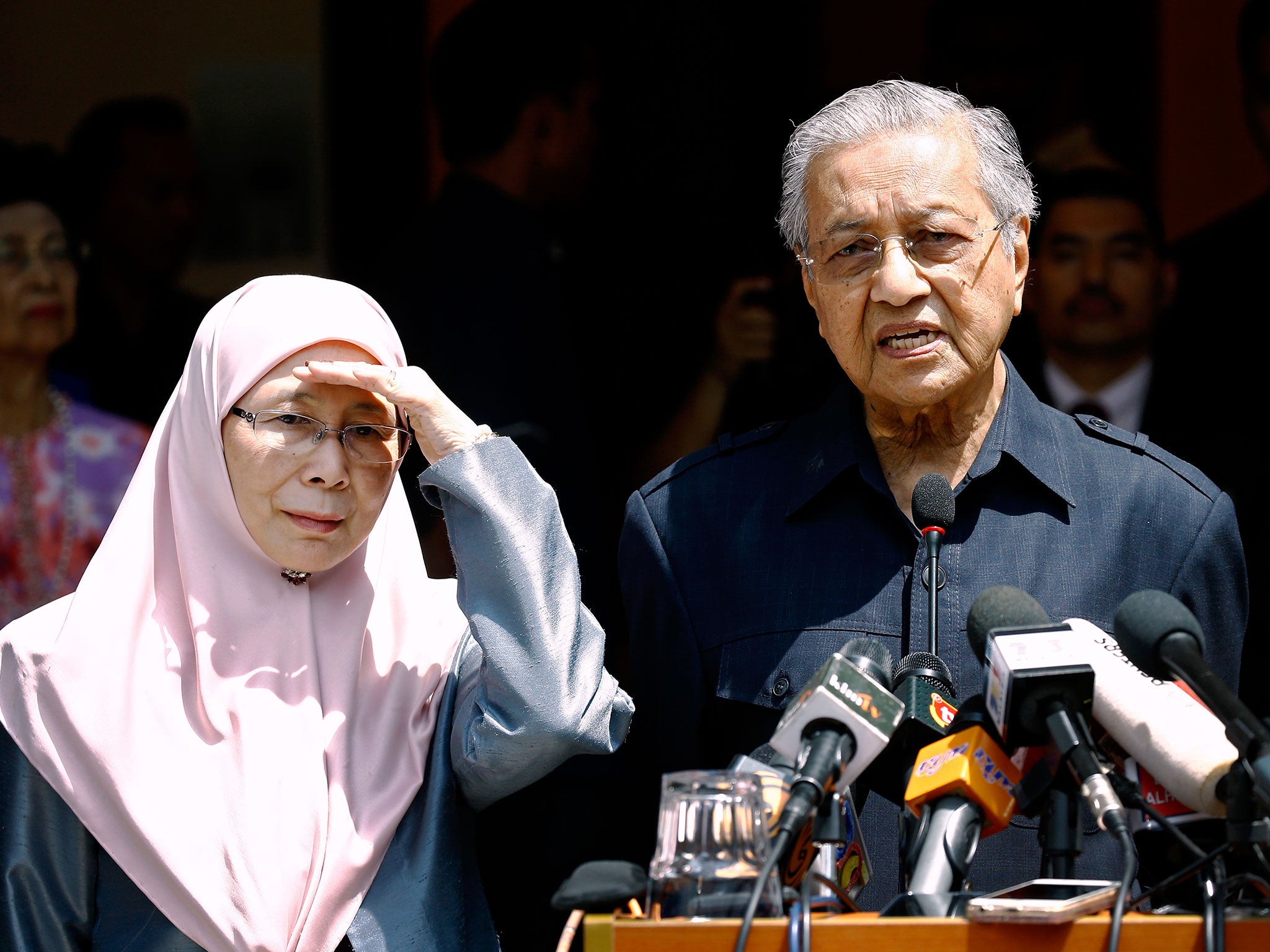 Malaysia's Prime Minister Mahathir Mohamad, right, speaks next to President of Justice Party Wan Azizah, wife of Anwar Ibrahim