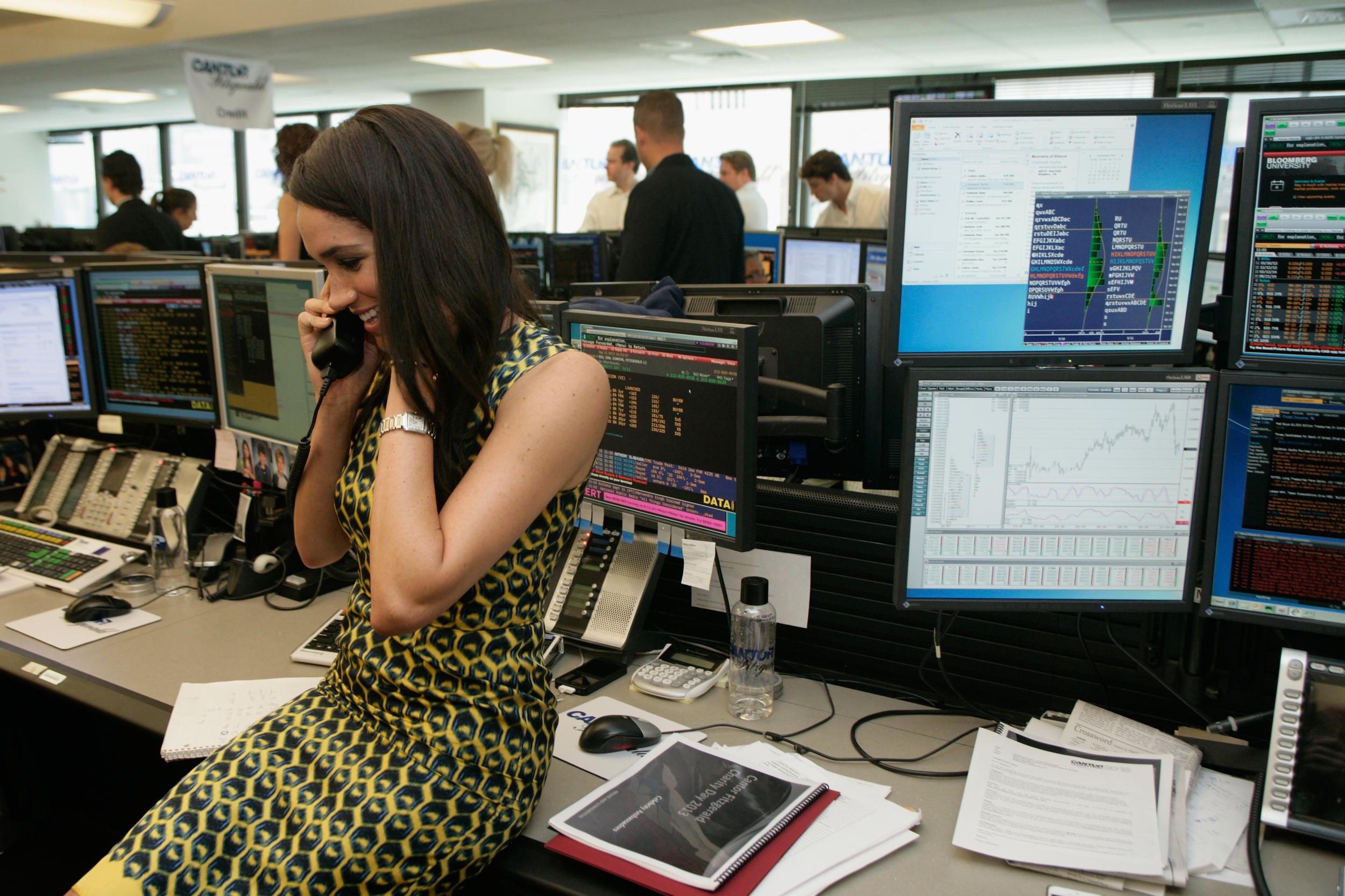 Meghan Markle wearing her Cartier watch while fundraising at the Annual Charity Day at the Cantor Fitzgerald Office in New York in 2013