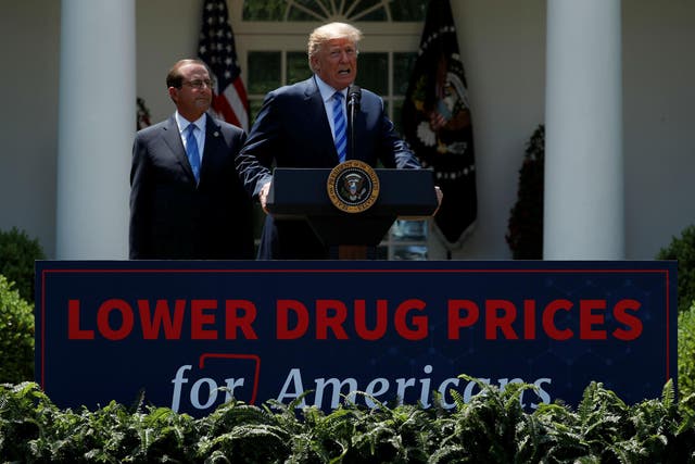 Secretary of Health and Human Services Alex Azar looks on as President Donald Trump speaks during an event about prescription drug prices in the Rose Garden of the White House, Friday