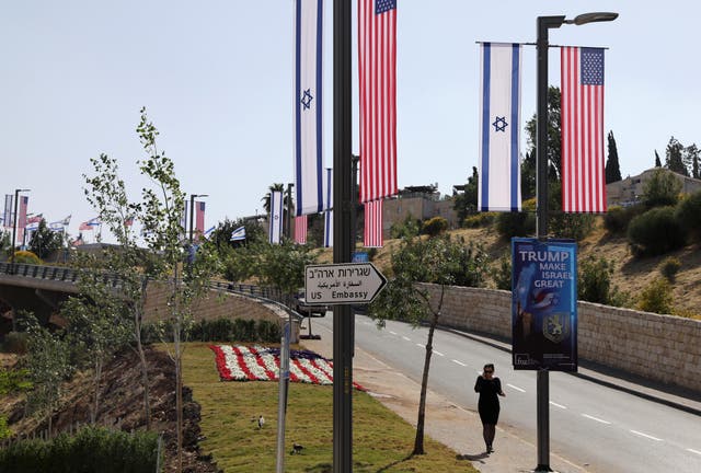 Flags and a floral display in red, white and blue near the new US embassy