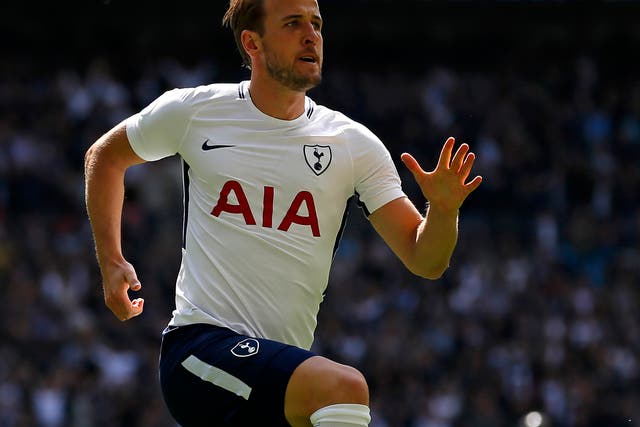 Harry Kane celebrates winning Tottenham the match