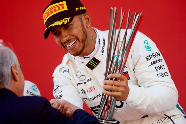 Lewis Hamilton celebrates extending his World Championship lead