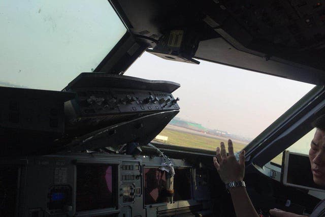 The plane's flight control unit was damaged and one pilot was injured
