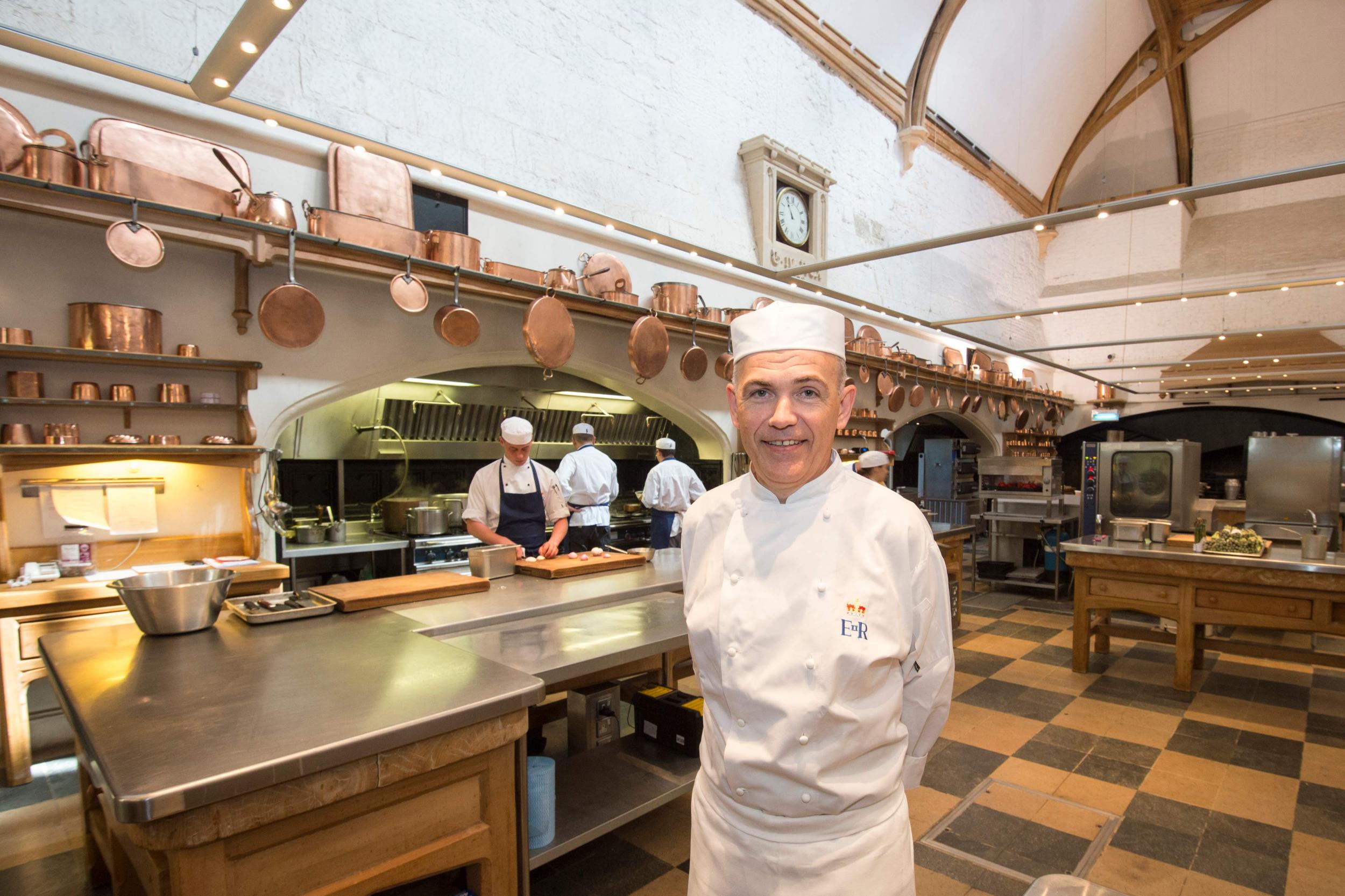 Head chef Mark Flanagan poses in the Royal Kitchen at Windsor Castle in Windsor as preparations begin for the wedding banquet for the royal wedding.