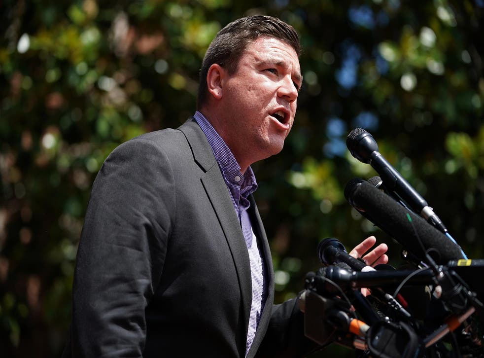 Jason Kessler, an organizer of 'Unite the Right' rally, tries to speak while being shouted down by counter protesters outside the Charlottesville City Hall