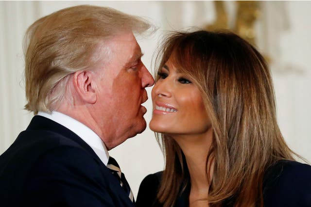 Donald Trump kisses his wife first lady Melania Trump