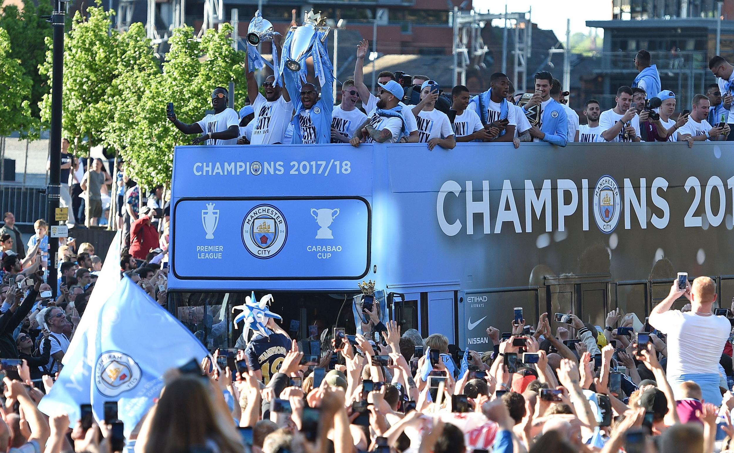Thousands lined the streets of Manchester for a bus parade
