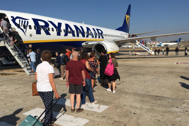 Sitting comfortably? Passengers boarding a Ryanair flight at Lisbon Airport