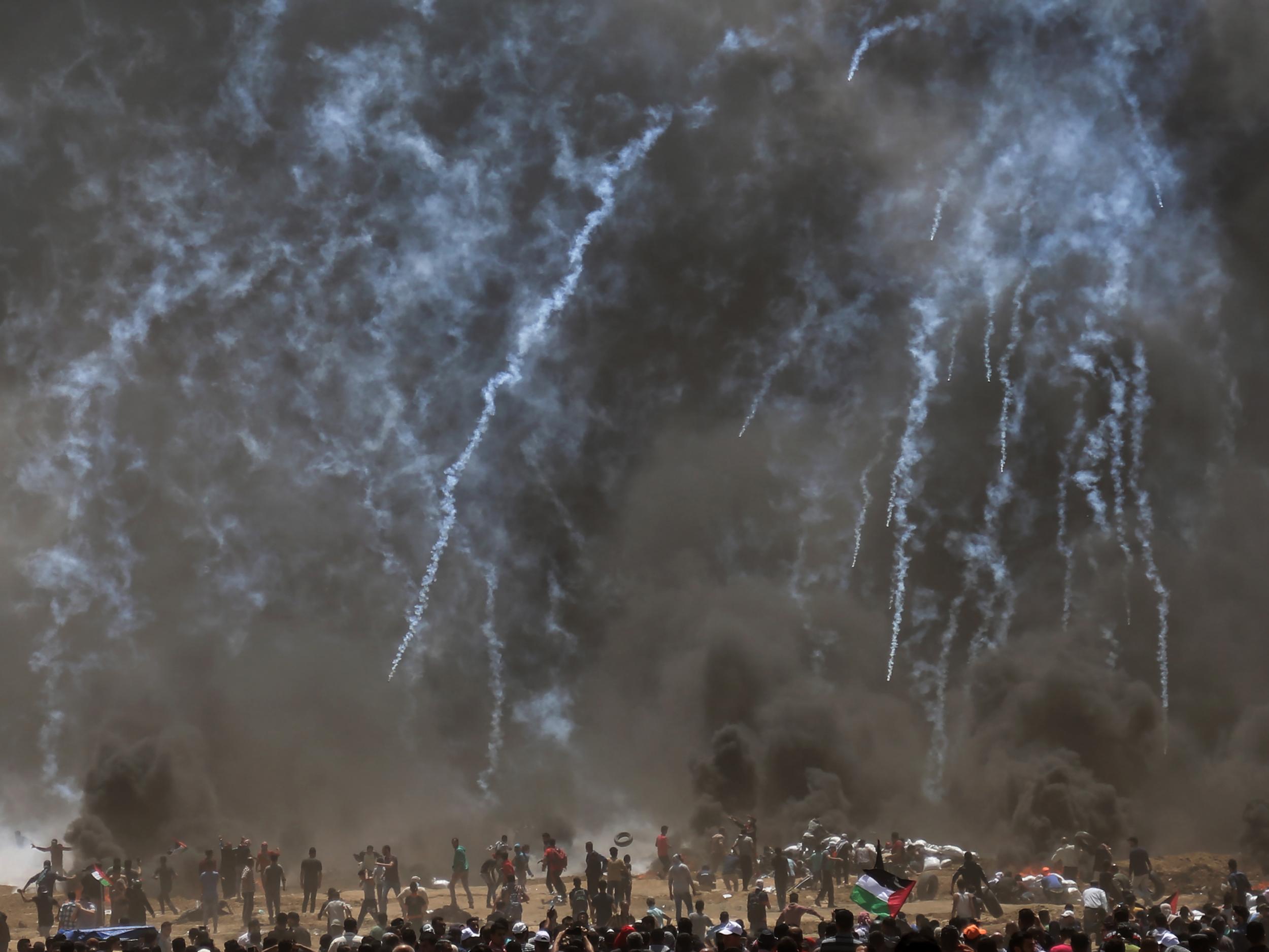Israeli troops fire teargas at Palestinian protesters during clashes in the northern Gaza Strip on Monday