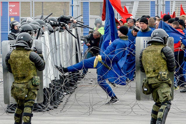 Russian riot policemen take part in special security exercises at the Saint Petersburg's Krestovsky Stadium in April ahead of this summer's World Cup