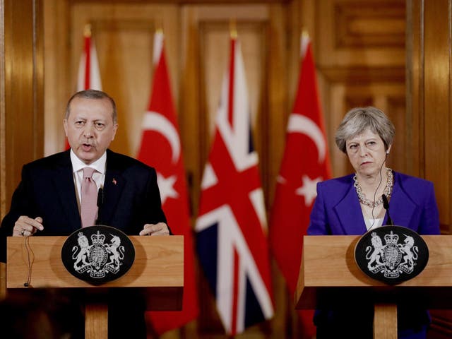 President Erdogan alongside Theresa May in Downing Street