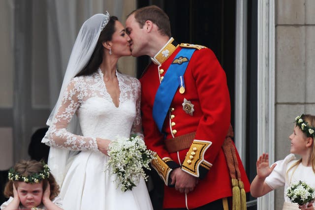 Grace van Cutsem covers her ears as the Duke and Duchess of Cambridge kiss on the balcony at Buckingham Palace on the day of their wedding in 2011.