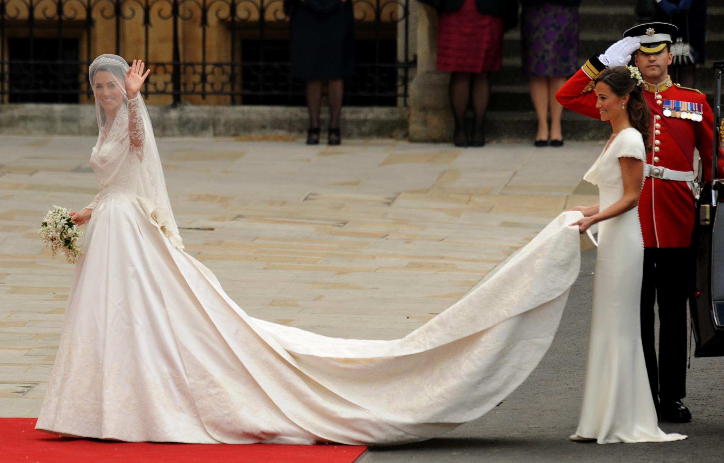 Pippa Middleton held the wedding dress of her sister as they both entered Westminster Abbey