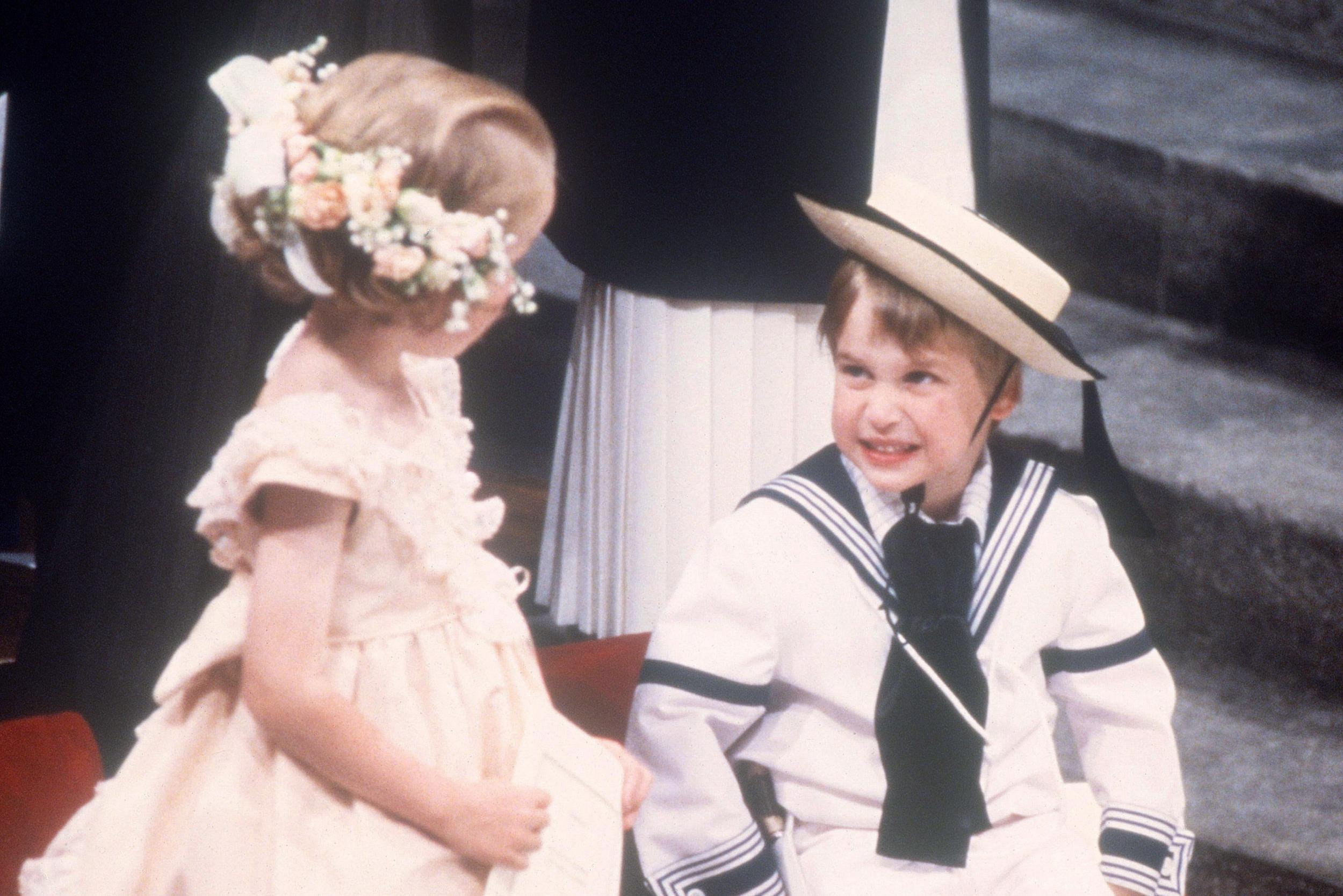 Prince William smiles at a bridesmaid at the wedding of Prince Andrew and Sarah Ferguson in 1986