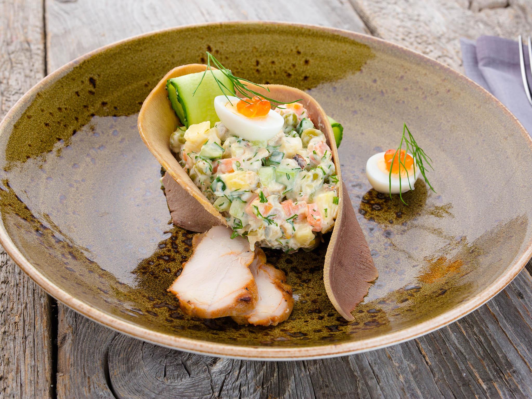 Olivier salad: baked chicken, boiled beef tongue, potatoes, eggs, carrots, pickled, cucumbers, peas and mayo (Shinok)