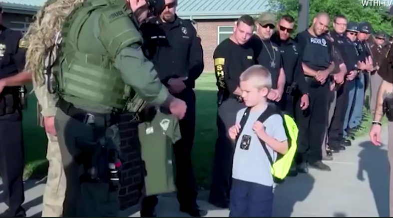 SWAT officers presented Dakota with his very own SWAT shirt (WTHI-TV)