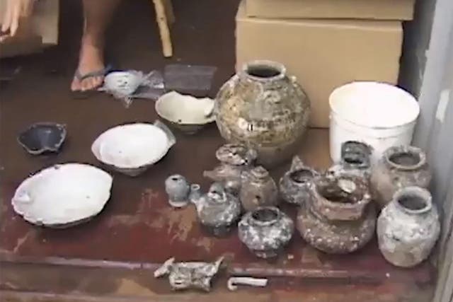 A mysterious shipwreck discovered in the 1980s off the coast of Indonesia has been traced back to a specific time and place in China owing to a stamp on a piece of pottery the archaeologists describe as being like a “made in China” label