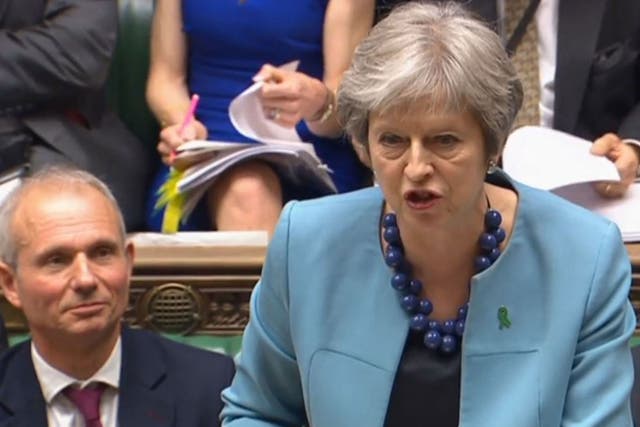 Theresa May speaks during Prime Minister's Questions alongside David Lidington