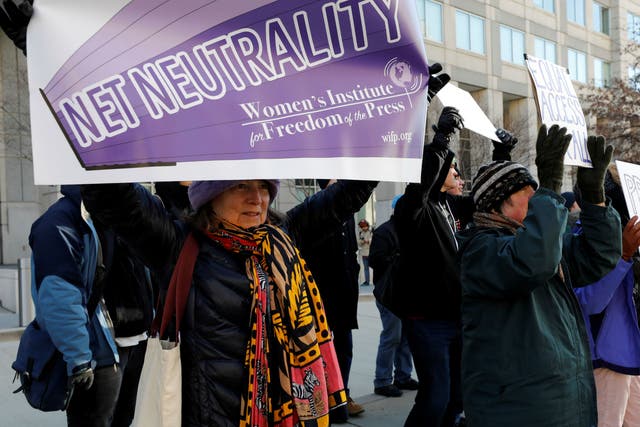 Net neutrality advocates rallied in front of the Federal Communications Commission ahead of the vote repealing so-called net neutrality rules