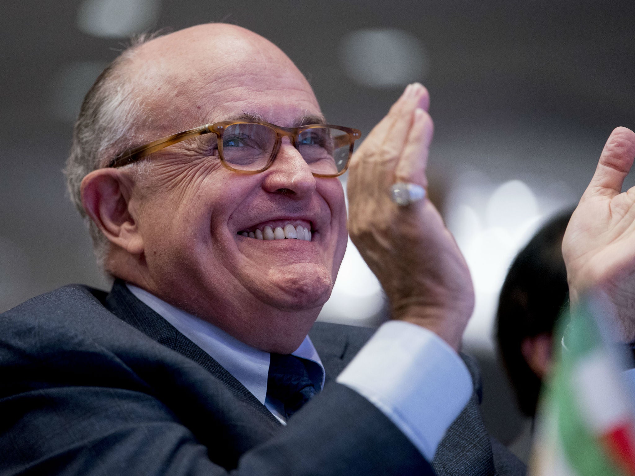 Rudy Giuliani applauds at the Iran Freedom Convention for Human Rights and democracy at the Grand Hyatt in Washington