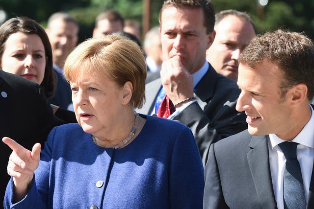 Angela Merkel and Emmanuel Macron  arrive at an informal European Union (EU) summit