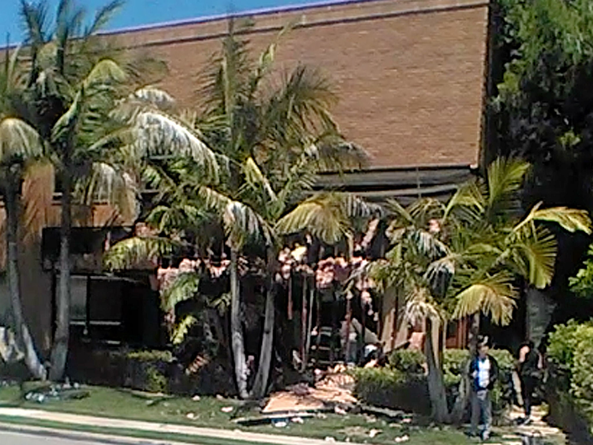 This image taken from cellphone video shows a building after a fatal explosion in Aliso Viejo, California