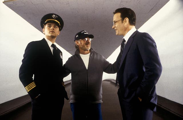 DiCaprio and Spielberg with Tom Hanks during filming on Catch Me If You Can in 2002