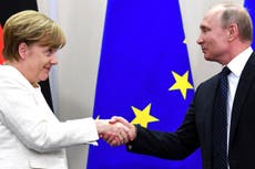 Merkel and Putin offer signs of thawing tensions at Russian talks