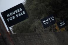 UK average house price hits record high but number of sales is falling